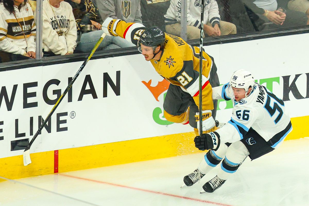 Vegas Golden Knights F Brett Howden (21) jumps past Utah Mammoth F Kailer Yamamoto (56) while chasing a puck during Round 1 of the NHL Playoffs on Sunday, April 19, 2026, in Las Vegas, Nevada. 