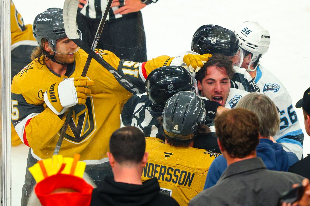 Utah Mammoth D Sean Durzi (50) yells at Vegas Golden Knights D Rasmus Andersson (4) during a scrum at Round 1 of the NHL Playoffs on Sunday, April 19, 2026, in Las Vegas, Nevada. 