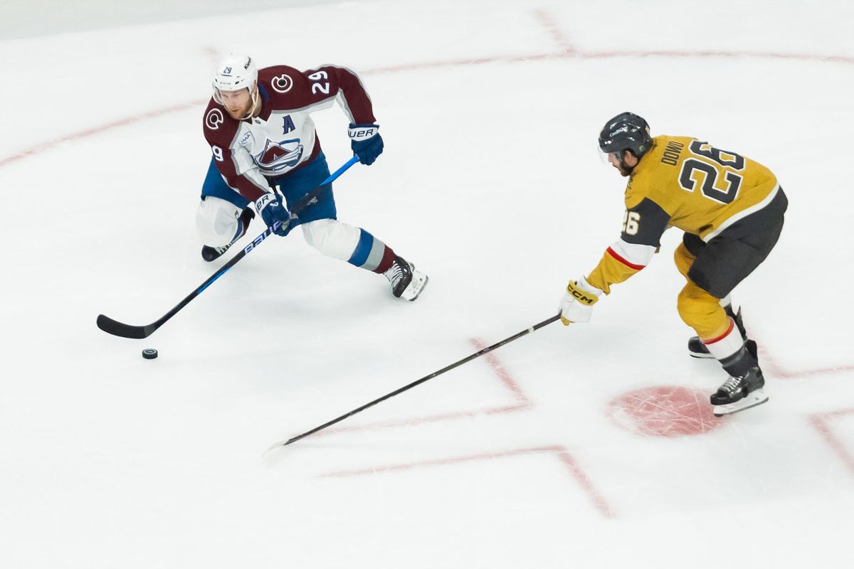 Colorado Avalanche center Nathan MacKinnon (29) looks to pass the puck during game 4 of a NHL playoff game of the semi-final round between the Vegas Golden Knights and the Colorado Avalanche, Tuesday May 26, 2026 in Las Vegas, Nev. Colorado Avalanche center Nathan MacKinnon (29) looks to pass the puck during game 4 of a NHL playoff game of the semi-final round between the Vegas Golden Knights and the Colorado Avalanche, Tuesday May 26, 2026 in Las Vegas, Nev.