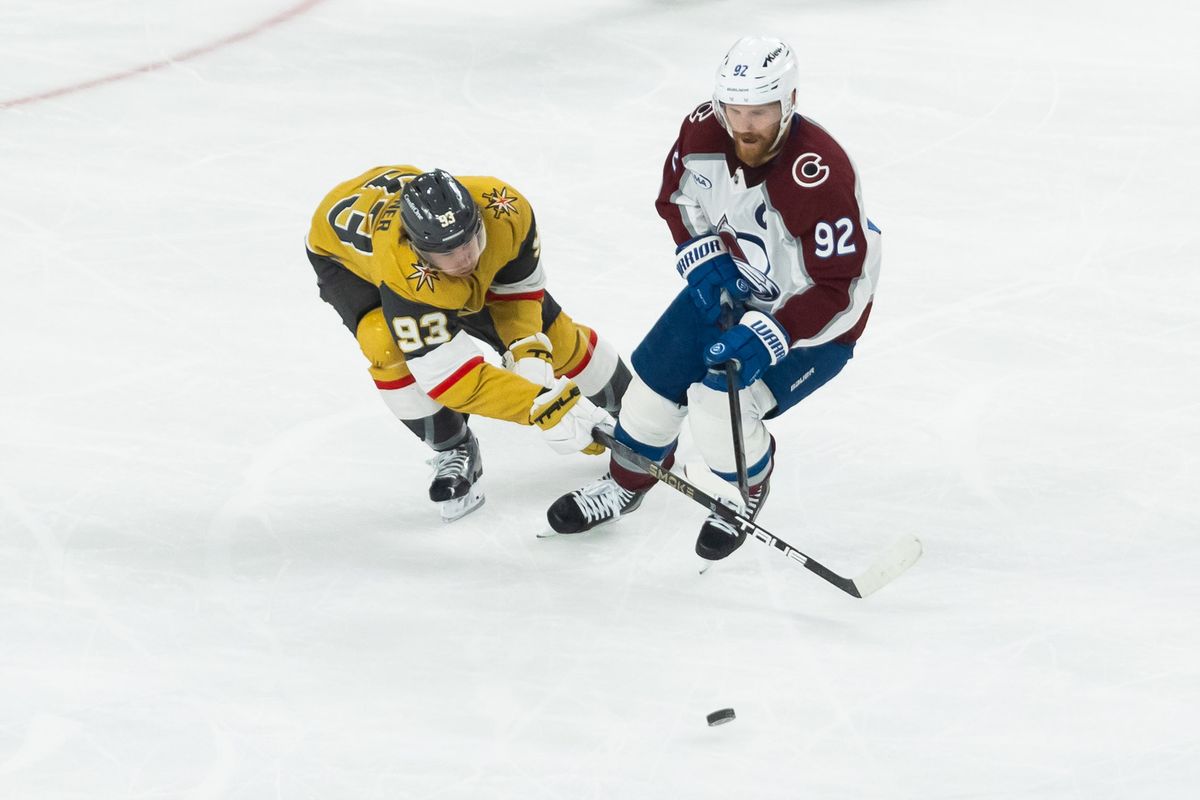 Colorado Avalanche left-wing Gabriel Landeskog (92) and Vegas Golden Knights right-wing Mitch Marner (93) go after a loose puck during game 4 of a NHL playoff game of the semi-final round between the Vegas Golden Knights and the Colorado Avalanche, Tuesday May 26, 2026 in Las Vegas, Nev. Colorado Avalanche left-wing Gabriel Landeskog (92) and Vegas Golden Knights right-wing Mitch Marner (93) go after a loose puck during game 4 of a NHL playoff game of the semi-final round between the Vegas Golden Knights and the Colorado Avalanche, Tuesday May 26, 2026 in Las Vegas, Nev.