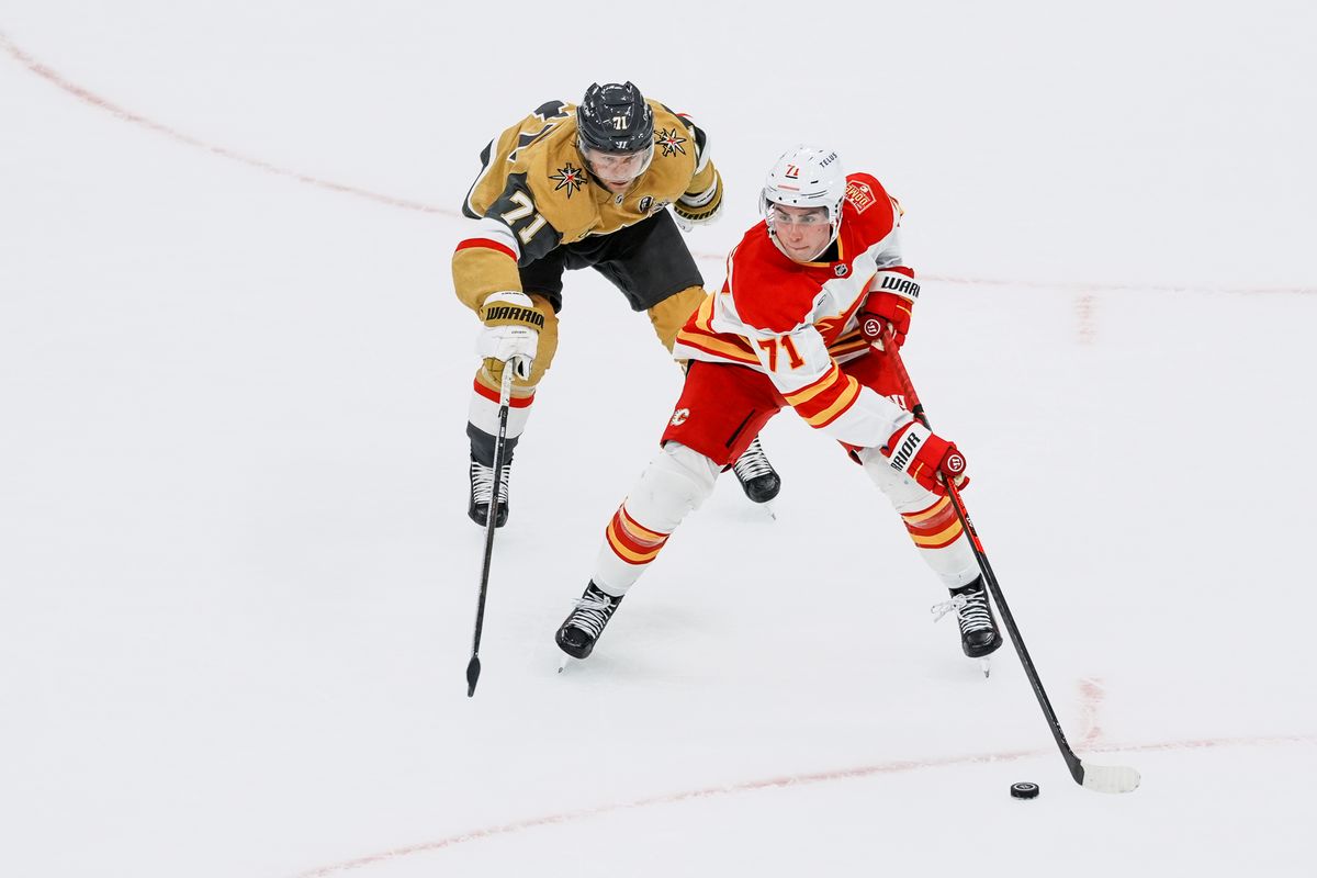 Calgary Flames defenseman Siman Nemec skates the puck down the ice followed by Vegas Golden Knights center William Karlsson during second period of NHL game against Vegas Golden Knights on Thursday October 15, 2026 at T-Mobile Arena in Las Vegas. Calgary Flames defenseman Siman Nemec skates the puck down the ice followed by Vegas Golden Knights center William Karlsson during second period of NHL game against Vegas Golden Knights on Thursday October 15, 2026 at T-Mobile Arena in Las Vegas.