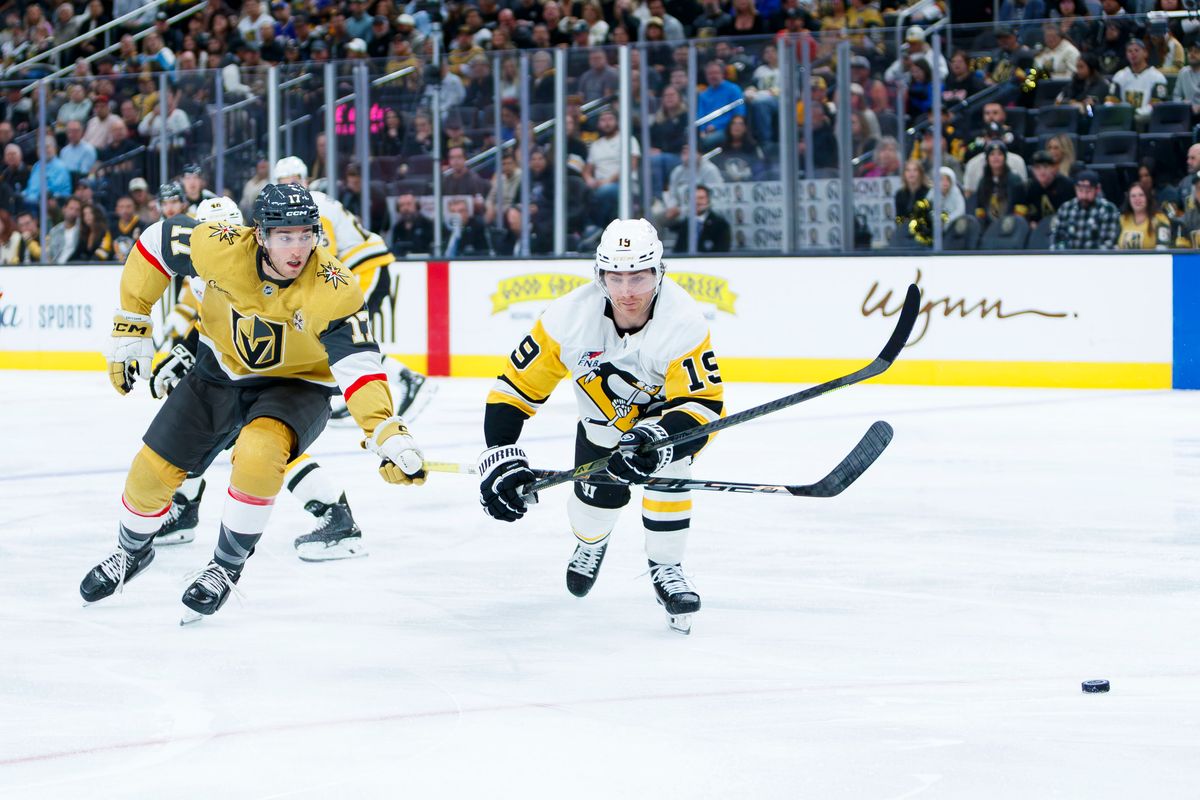 Vegas Golden Knights center Marc Gatcomb (17) and Pittsburgh Penguins center Connor Dewar (19) battle for the puck during an NHL game against the Pittsburgh Penguins on October 17, 2026 at T-Mobile Arena. Vegas Golden Knights center Marc Gatcomb (17) and Pittsburgh Penguins center Connor Dewar (19) battle for the puck during an NHL game against the Pittsburgh Penguins on October 17, 2026 at T-Mobile Arena.