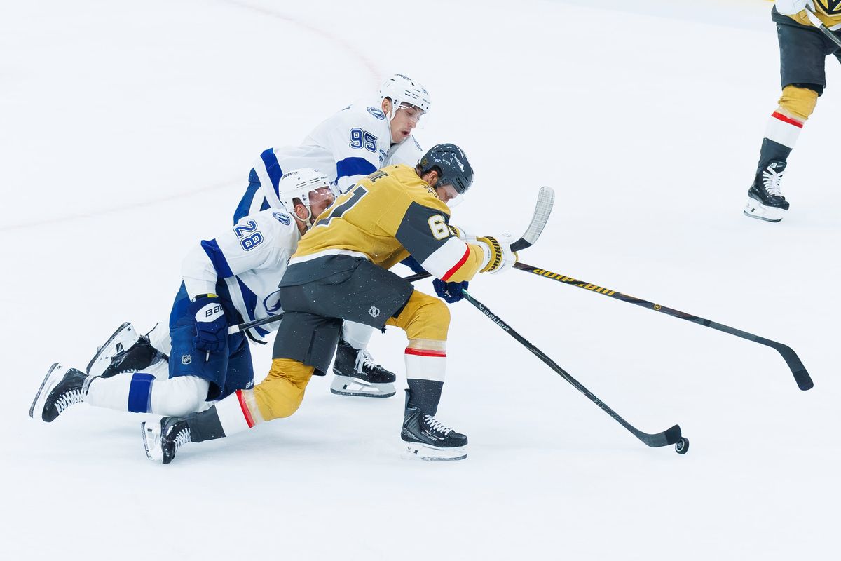 Vegas Golden Knights right wing Mark Stone (61) fights for possession of the puck during an NHL game against the Tampa Bay Lightning on Tuesday, October 20, 2026, at T-Mobile Arena in Las Vegas, Nevada. Vegas Golden Knights right wing Mark Stone (61) fights for possession of the puck during an NHL game against the Tampa Bay Lightning on Tuesday, October 20, 2026, at T-Mobile Arena in Las Vegas, Nevada.