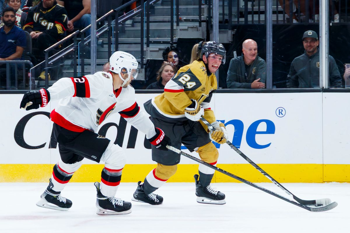 Vegas Golden Knights left wing Trevor Connelly (24) fights to maintain possession of the puck during an NHL game against the Ottawa Senators on Tuesday, October 27, 2026, at T-Mobile Arena in Las Vegas, Nevada.