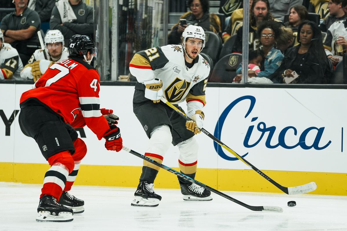 Vegas Golden Knights center Brett Howden (21) scans the ice while New Jersey Devils defenseman Declan Chisholm (47) skates towards him during second period of NHL game against New Jersey Devils on Friday October 30, 2026 at T-Mobile Arena in Las Vegas. Vegas Golden Knights center Brett Howden (21) scans the ice while New Jersey Devils defenseman Declan Chisholm (47) skates towards him during second period of NHL game against New Jersey Devils on Friday October 30, 2026 at T-Mobile Arena in Las Vegas.