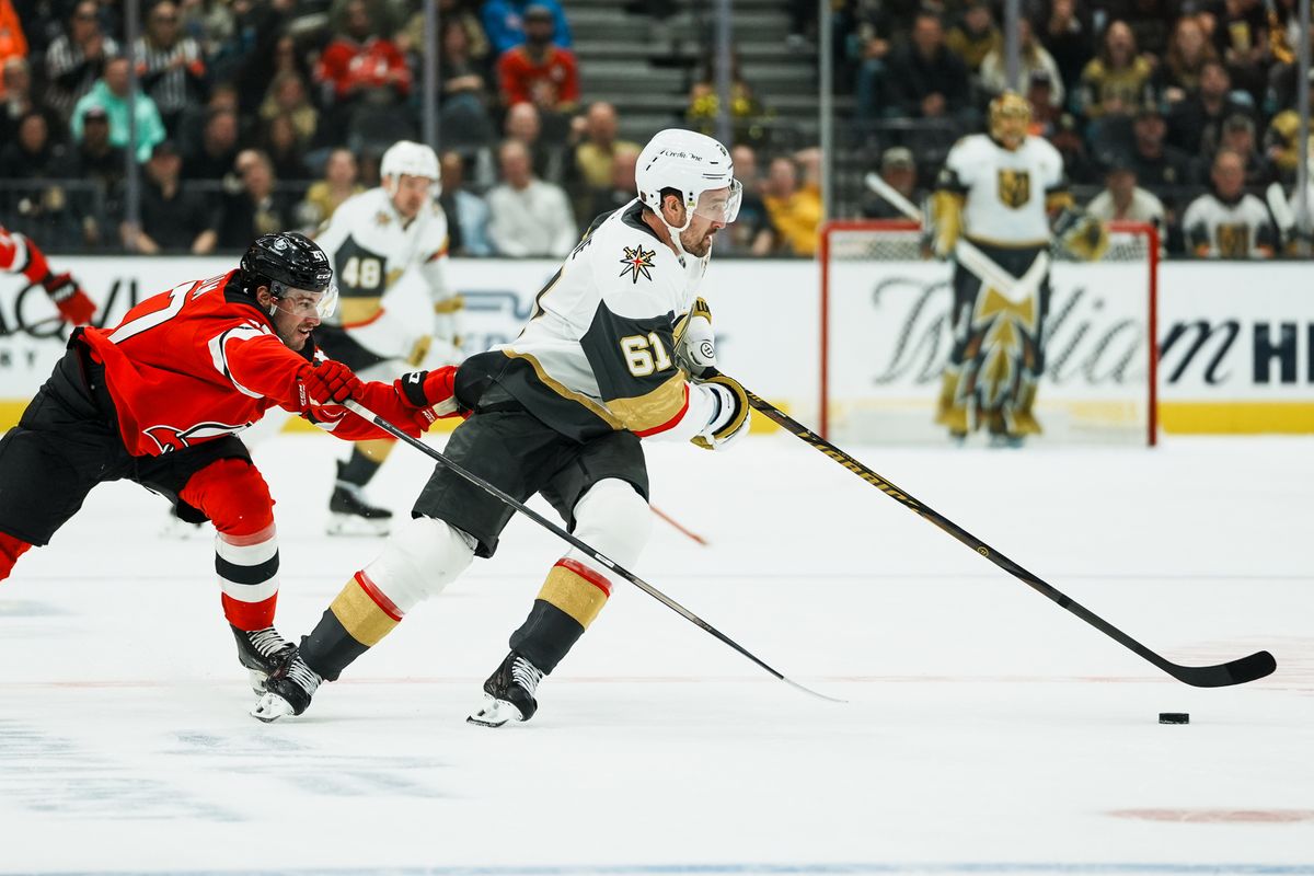 Vegas Golden Knights right wing Mark Stone (61) skates the puck away from New Jersey Devils defenseman Declan Chisholm (47) during second period of NHL game against New Jersey Devils on Friday October 30, 2026 at T-Mobile Arena in Las Vegas. Vegas Golden Knights right wing Mark Stone (61) skates the puck away from New Jersey Devils defenseman Declan Chisholm (47) during second period of NHL game against New Jersey Devils on Friday October 30, 2026 at T-Mobile Arena in Las Vegas.