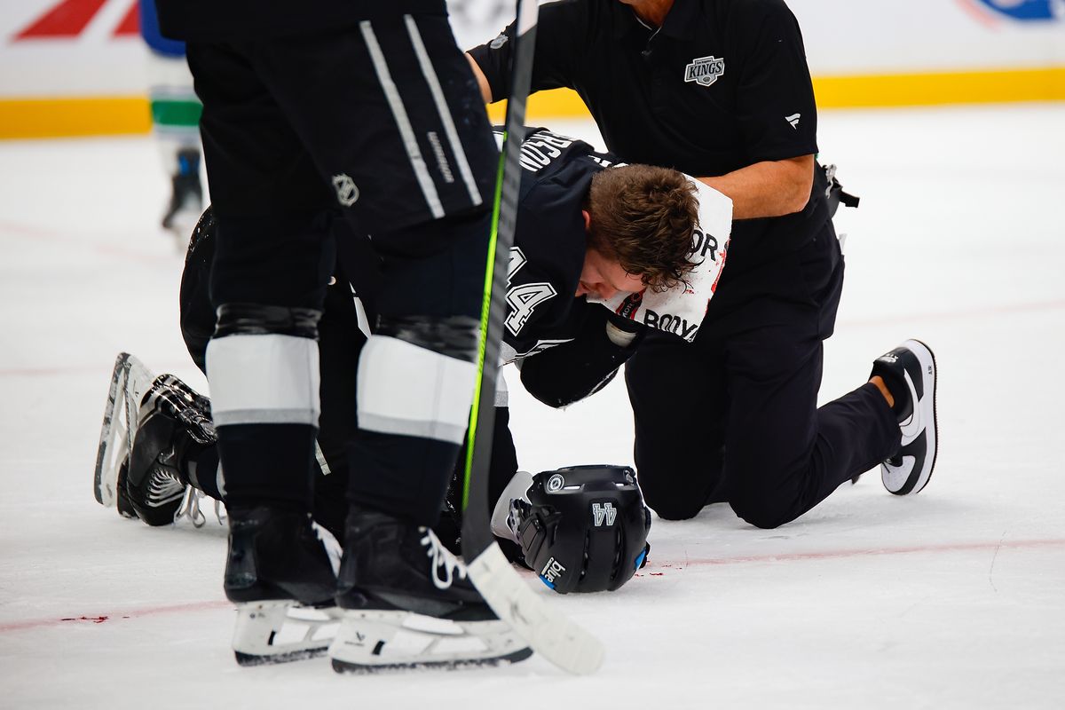 Los Angeles Kings defensemen Mikey Anderson (44) tries to stop bleeding after being hit on the left side of his head during game against Vancouver Canucks on Thursday, November 7, 2024 in Los Angeles. Los Angeles Kings defensemen Mikey Anderson (44) tries to stop bleeding after being hit on the left side of his head during game against Vancouver Canucks on Thursday, November 7, 2024 in Los Angeles.