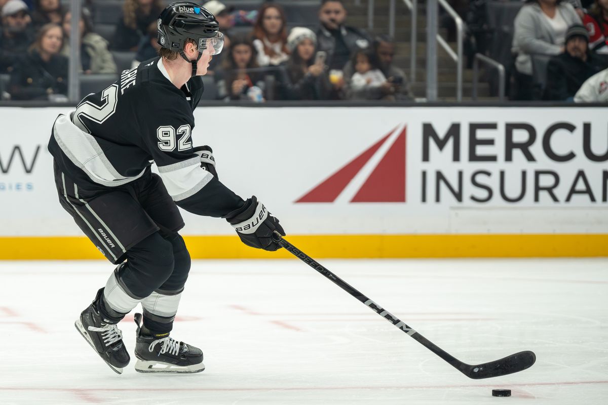 Brandt Clarke #92 of the Los Angeles Kings carries the puck up ice during the second period against the New Jersey Devils at Crypto.com Arena on January 1, 2025, in Los Angeles, California.