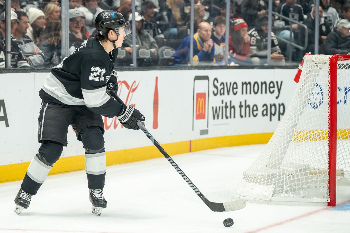 Jordan Spence #21 of the Los Angeles Kings prepares to make a pass during the second period against the New Jersey Devils at Crypto.com Arena on January 1, 2025, in Los Angeles, California.