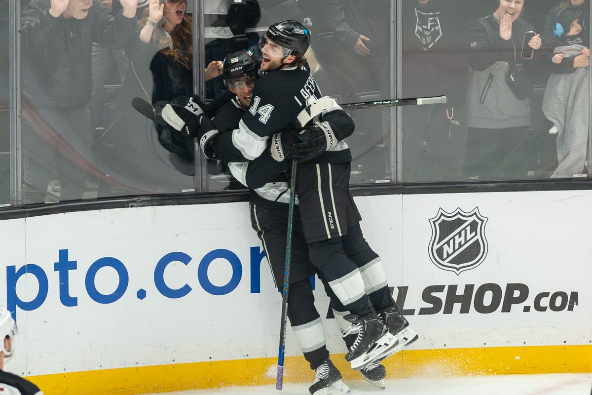 Alex Laferriere #14 of the Los Angeles Kings celebrates with teammate Quinton Byfield #55 after a goal during the third period against the New Jersey Devils at Crypto.com Arena on January 1, 2025, in Los Angeles, California.
