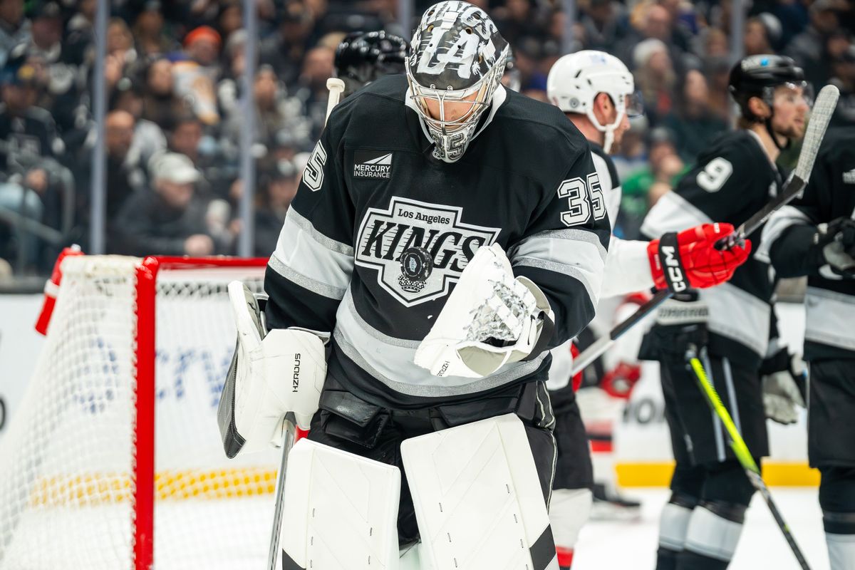 Darcy Kuemper #35 of the Los Angeles Kings flips the puck into the air after making a save during the second period against the New Jersey Devils at Crypto.com Arena on January 1, 2025, in Los Angeles, California.