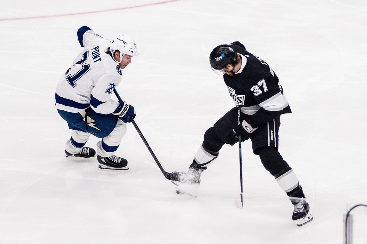 Los Angeles Kings LW (37) Warren Foegele battles for the puck against the Tampa Bay Lightning on January 4, 2025 at Crypto.com Arena
