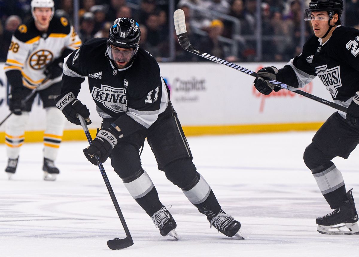 Los Angeles Kings Center, Anze Kopitar, 11, fighting through defense during an NHL hockey game against the Bruins on March 23, 2025 in Los Angeles, CA.