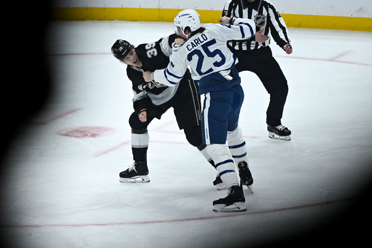 Los Angeles Kings Left Winger Jeff Malott (39) fights Toronto Maple Leafs Defenseman Brendan Carlo (25) during an NHL hockey game against the Toronto Maple Leafs, Saturday, March 29, 2025, in Los Angeles Calif. Los Angeles Kings Left Winger Jeff Malott (39) fights Toronto Maple Leafs Defenseman Brendan Carlo (25) during an NHL hockey game against the Toronto Maple Leafs, Saturday, March 29, 2025, in Los Angeles Calif.