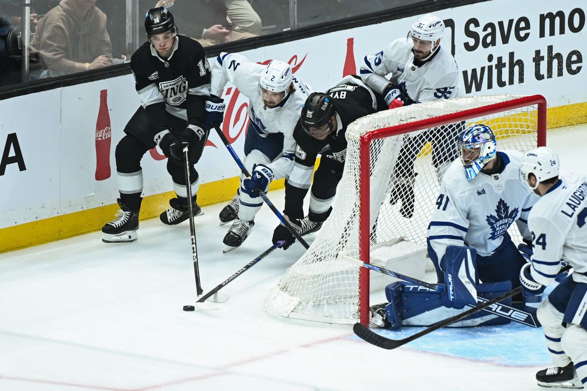 Los Angeles Kings Center Quinton Byfield (55) and Right Winger Alex Laferriere (14), and Toronto Maple Leafs Defensemen Simon Benoit (2) and Oliver Ekman-Larsson (95) chase down a puck during an NHL hockey game, Saturday, March 29, 2025, in Los Angeles Calif. Los Angeles Kings Center Quinton Byfield (55) and Right Winger Alex Laferriere (14), and Toronto Maple Leafs Defensemen Simon Benoit (2) and Oliver Ekman-Larsson (95) chase down a puck during an NHL hockey game, Saturday, March 29, 2025, in Los Angeles Calif.