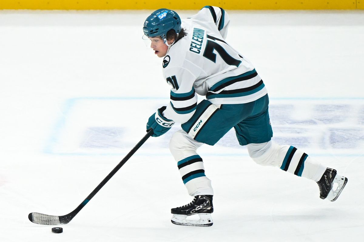 San Jose Sharks Center Macklin Celebrini (71) skates the puck into the offensive zone during an NHL hockey game against the Los Angeles Kings, Sunday, March 30, 2025, in Los Angeles Calif.