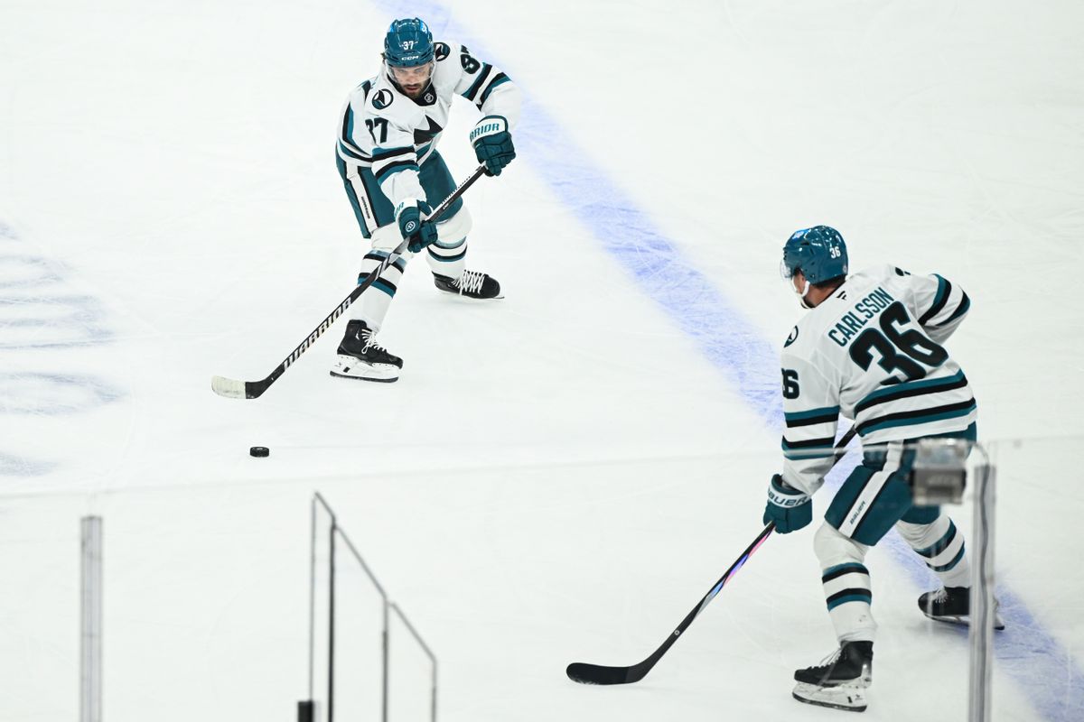 San Jose Sharks Defenseman Timothy Liljegren (37) passes the puck to San Jose Sharks Defenseman Lucas Carlsson (36) during an NHL hockey game against the Los Angeles Kings, Sunday, March 30, 2025, in Los Angeles Calif.