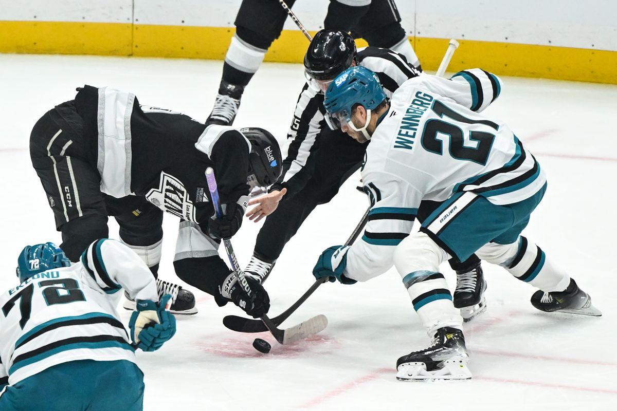 San Jose Sharks Center Alexander Wennberg (21) wins a faceoff against Los Angeles Kings Right Winger Quinton Byfield (55) during an NHL hockey game, Sunday, March 30, 2025, in Los Angeles Calif.