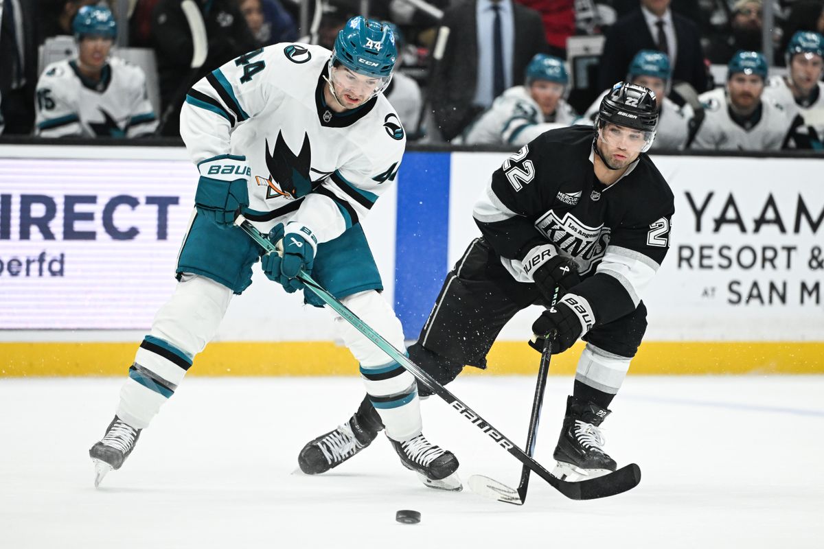Los Angeles Kings Left Winger Kevin Fiala (22) passes the puck past San Jose Sharks Defenseman Marc-Edouard Vlasic (44) during an NHL hockey game, Sunday, March 30, 2025, in Los Angeles Calif.