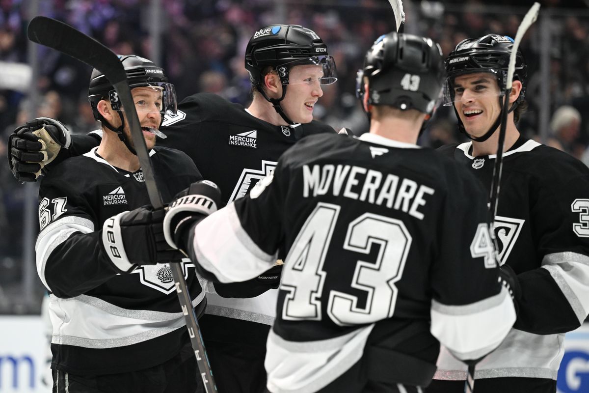 Los Angeles Kings Center Trevor Lewis (61), Center Samuel Helenius (79), Left Winger Jeff Malott (39), and Defenseman Jacob Moverare (43) celebrate after Lewis' goal during an NHL hockey game against the San Jose Sharks, Sunday, March 30, 2025, in Los Angeles Calif.