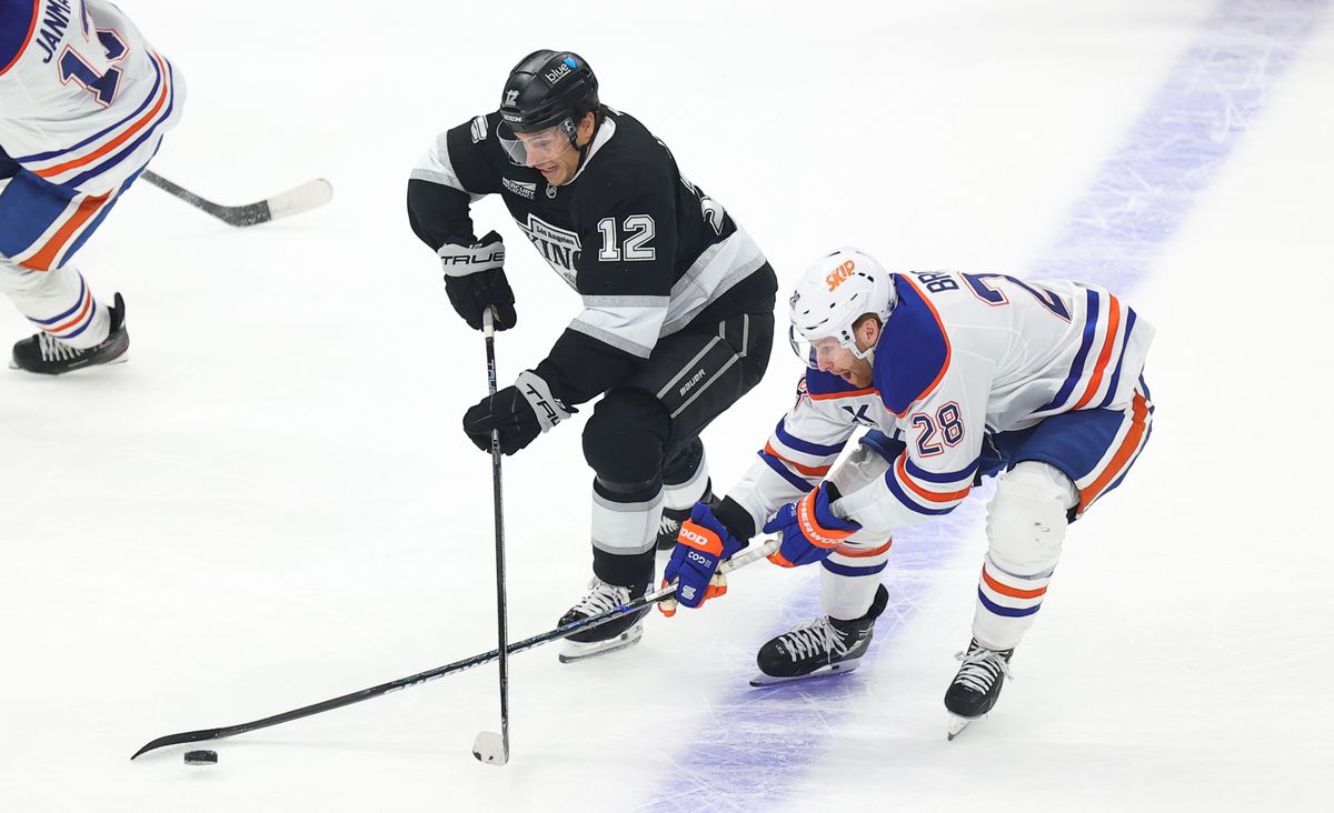 Los Angeles Kings LW (12) Trevor Moore battles for the puck against the Edmonton Oilers on April 5, 2025 at Crypto.com Arena. Los Angeles Kings LW (12) Trevor Moore battles for the puck against the Edmonton Oilers on April 5, 2025 at Crypto.com Arena.