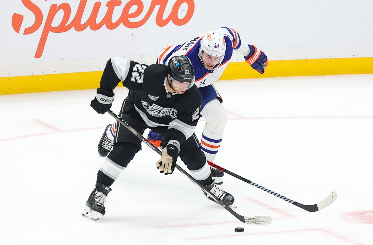 Los Angeles Kings LW (22) Kevin Fiala tries to move the puck against the Edmonton Oilers on April 5, 2025 at Crypto.com Arena in Los Angeles, CA. Los Angeles Kings LW (22) Kevin Fiala tries to move the puck against the Edmonton Oilers on April 5, 2025 at Crypto.com Arena in Los Angeles, CA.