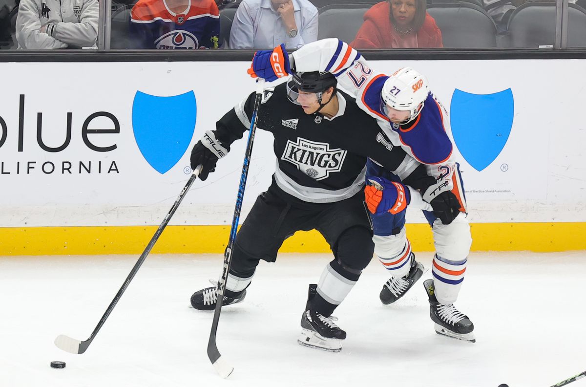 Los Angeles Kings LW (12) Trevor Moore battles for the puck against the Edmonton Oilers on April 5, 2025 at Crypto.com Arena. Los Angeles Kings LW (12) Trevor Moore battles for the puck against the Edmonton Oilers on April 5, 2025 at Crypto.com Arena.