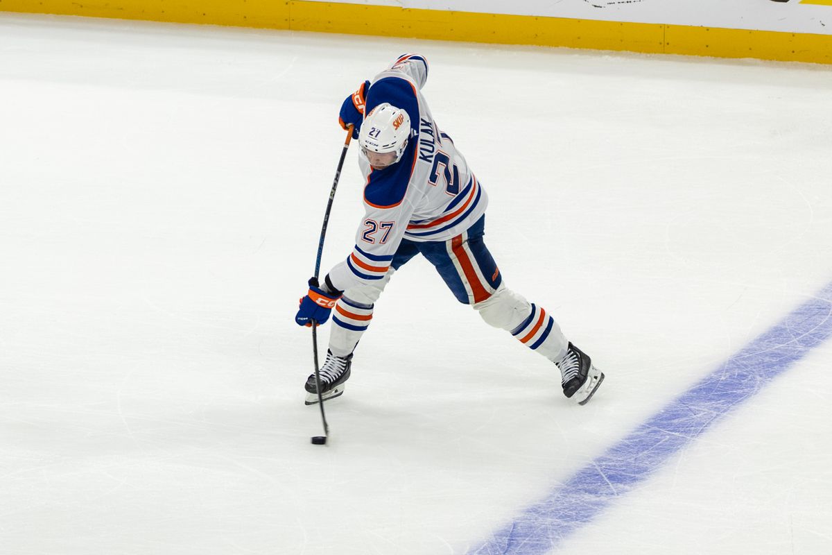 Edmonton Oilers defenseman Brett Kulak (27) shoots the puck during Game 5 of the NHL Stanley Cup Playoffs against the Los Angeles Kings, Tuesday April 29, 2025 in Los Angeles, Calif.