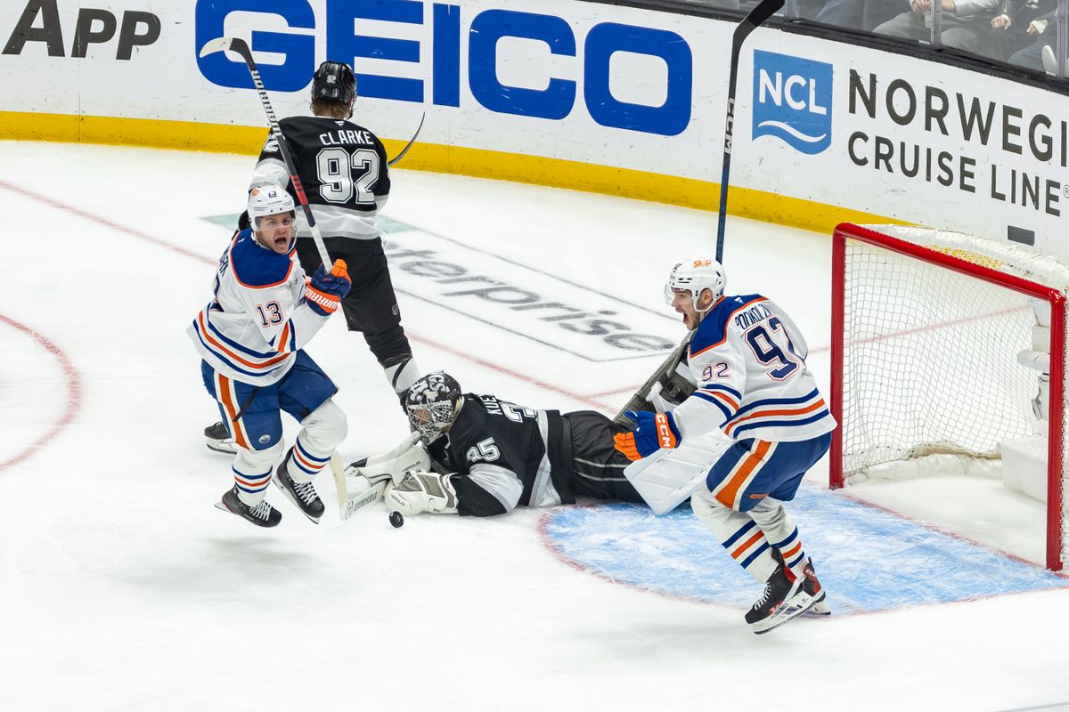 Edmonton Oilers forwards Mattias Janmark (13) and Vasily Podkolzin (92) celebrate the game-winning goal during Game 5 of the NHL Stanley Cup Playoffs against the Los Angeles Kings, Tuesday April 29, 2025 in Los Angeles, Calif.