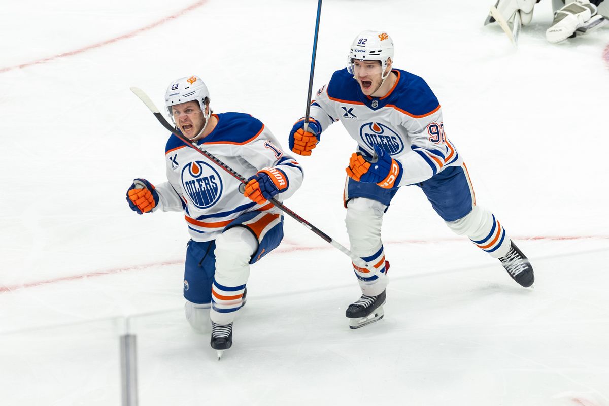 Edmonton Oilers forwards Mattias Janmark (13) and Vasily Podkolzin (92) celebrate the game-winning goal during Game 5 of the NHL Stanley Cup Playoffs against the Los Angeles Kings, Tuesday April 29, 2025 in Los Angeles, Calif.
