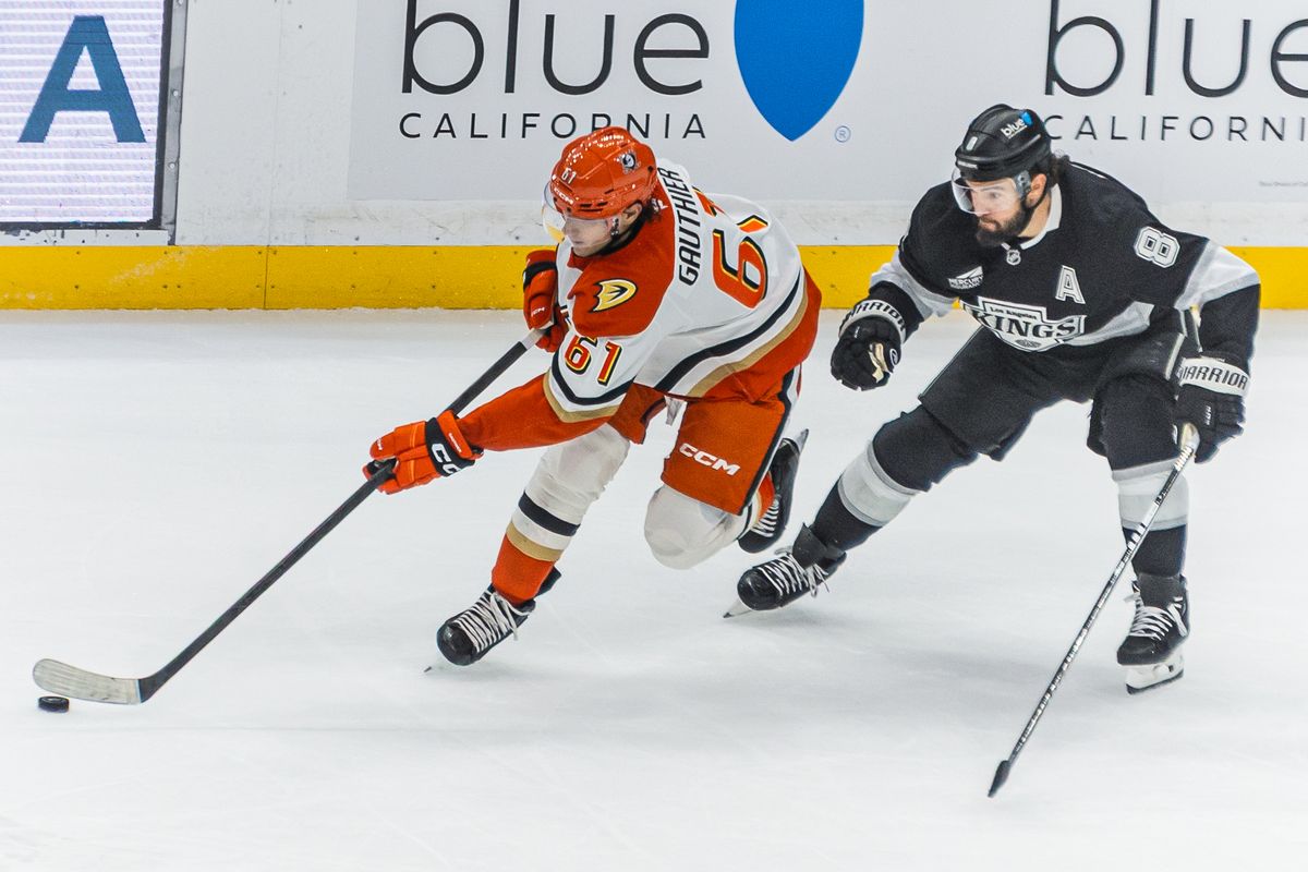 Anaheim Ducks Cutter Gauthier defends the puck against Drew Doughty (8) during an NHL hockey game against the Los Angeles Kings, Saturday October 4, 2025 in Los Angeles, Calif.