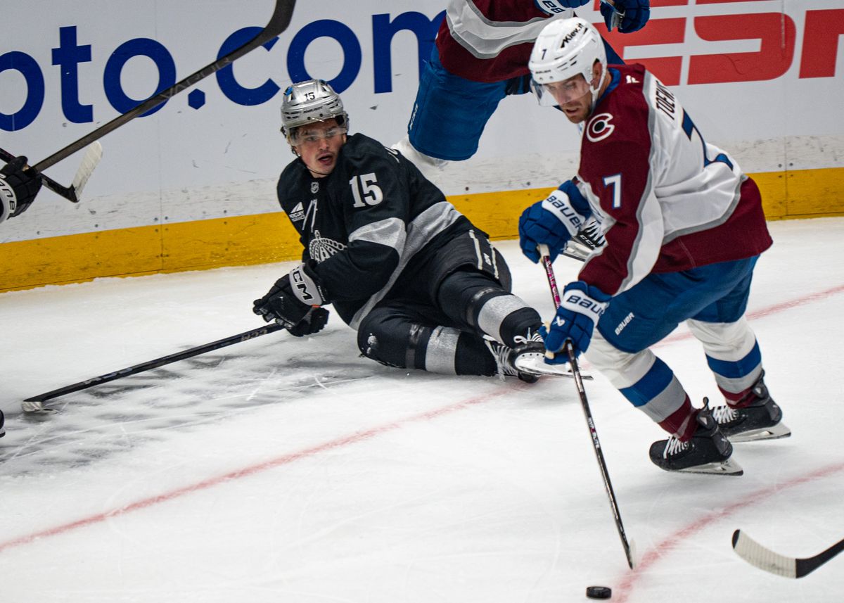 Los Angeles Kings center, Alex Turcotte 15, loses possession of the puck and slides down during an NHL hockey game against the Colorado Avalanche at Crypto.com Arena in Los Angeles on October 07, 2025
