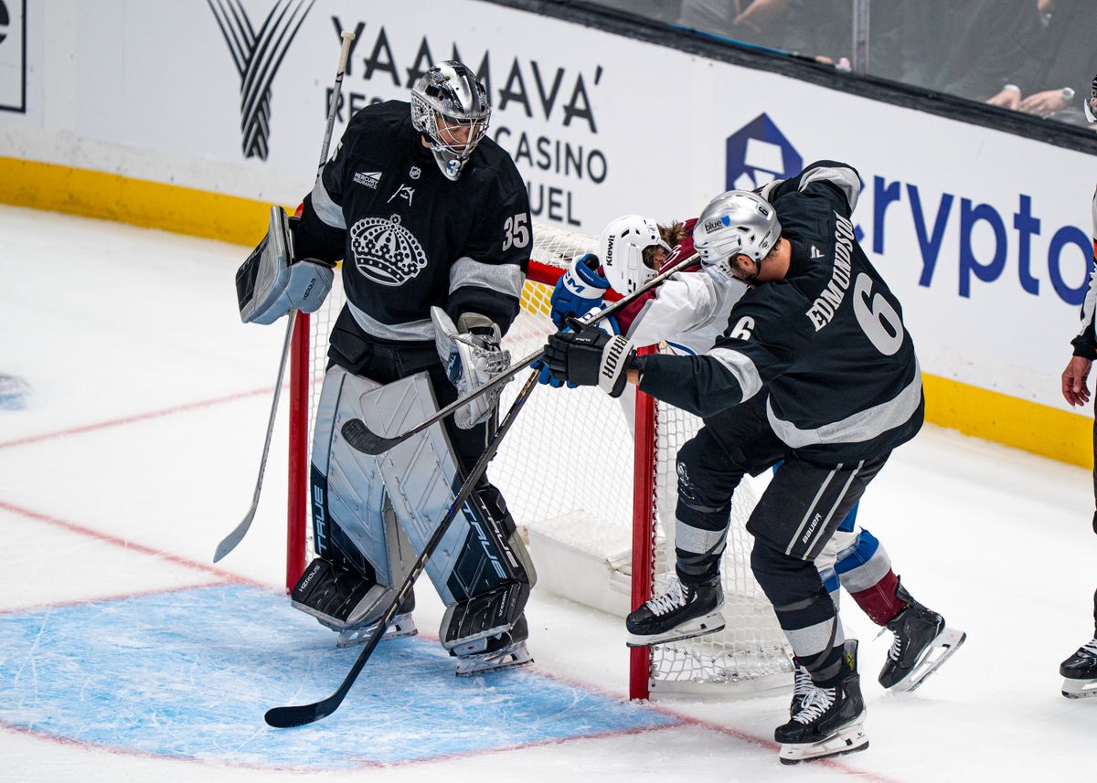 Los Angeles Kings defenseman, Joel Edmundson 6, shoves an Avalanche player after a failed goal during an NHL hockey game against the Colorado Avalanche at Crypto.com Arena in Los Angeles on October 07, 2025