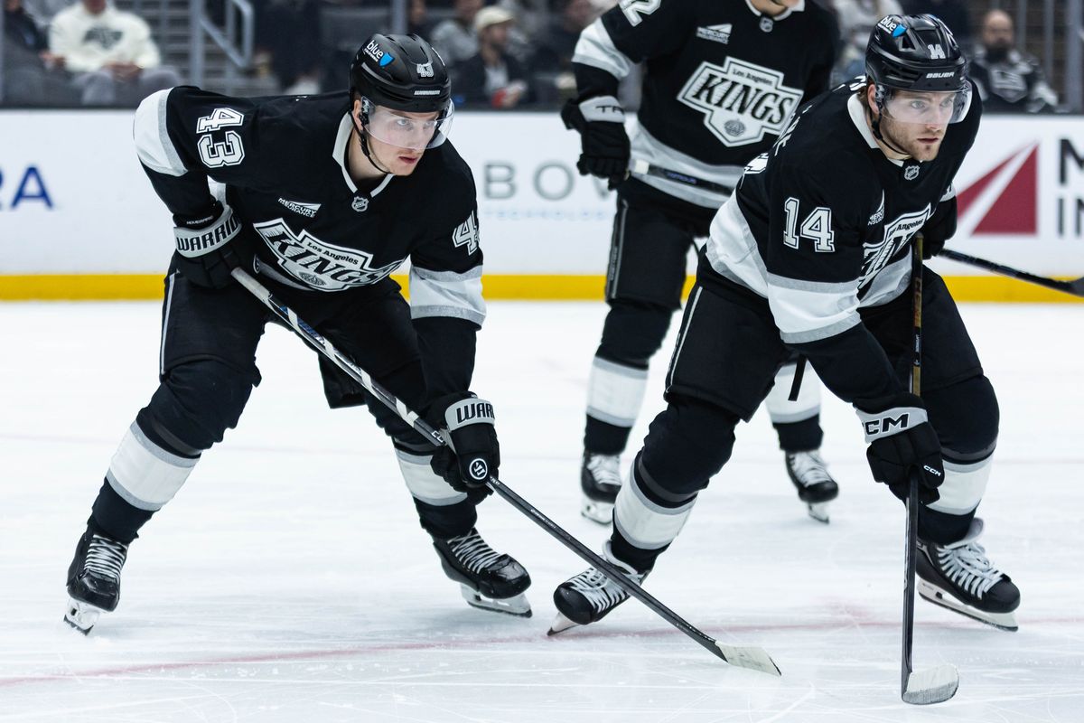 Los Angeles Kings defense Jacob Moverare (43) and right wing Alex Laferriere (14) waits for the puck to drop during an NHL game against the Ottawa Senators on November 24, 2025 in Los Angeles, Calif.