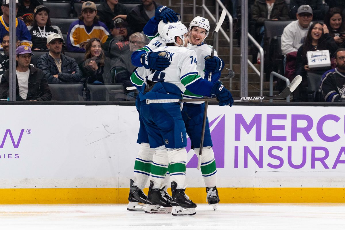 Vancouver Canucks players celebrate a goal during an NHL game between the Vancouver Canucks and the Los Angeles Kings, Saturday November 29, 2025 at Crypto.com Arena in Los Angeles, Calif.