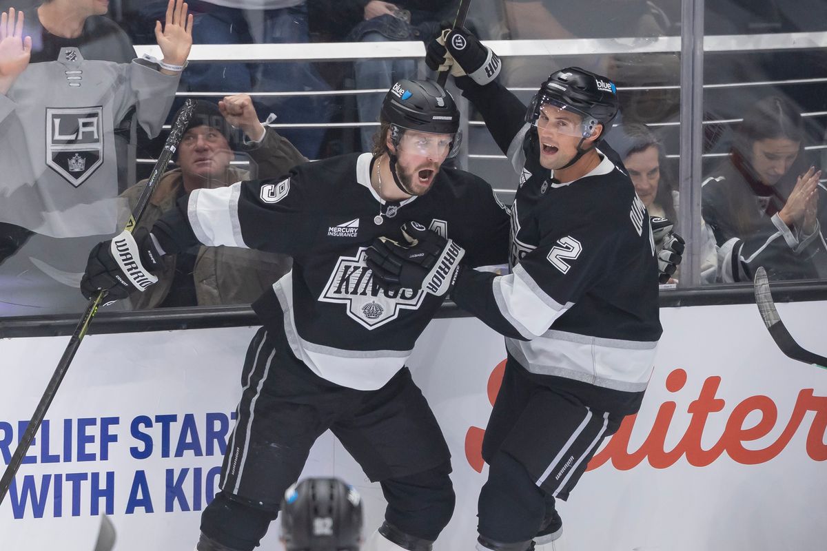 Right wing Adrian Kempe #9 and defenseman Brian Dumoulin #2 of the Los Angeles Kings celebrate a goal during an NHL hockey game against the Washington Capitals, Tuesday December 2, 2025 in Los Angeles, Calif.