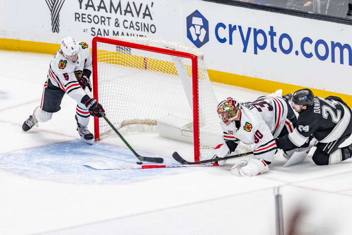 Defenseman Connor Murphy #5 of the Chicago Blackhawks saves a shot by center Phillip Danault #24 of the Los Angeles Kings during an NHL hockey game, Thursday December 4, 2025 in Los Angeles, Calif.