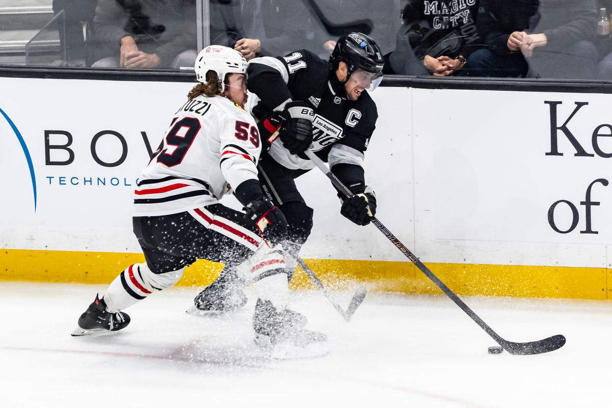 Center Anze Kopitar #11 of the Los Angeles Kings fights for the puck with left wing Tyler Bertuzzi #59 of the Chicago Blackhawks during an NHL hockey game, Thursday December 4, 2025 in Los Angeles, Calif.
