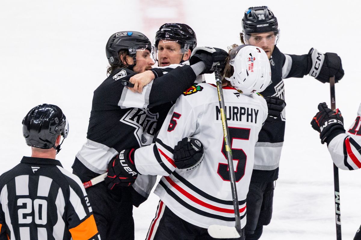 Right wing Adrian Kempe #9 of the Los Angeles Kings and defenseman Connor Murphy #5 of the Chicago Blackhawks come to blows during an NHL hockey game, Thursday December 4, 2025 in Los Angeles, Calif.