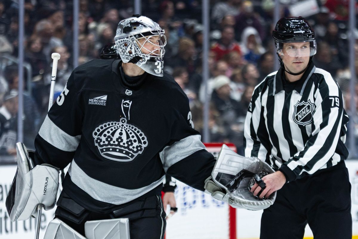 Los Angeles Kings goalie Darcy Kuemper (35) gives the puck to the referee during an NHL game against the Chicago Blackhawks on December 6, 2025 in Los Angeles, Calif.