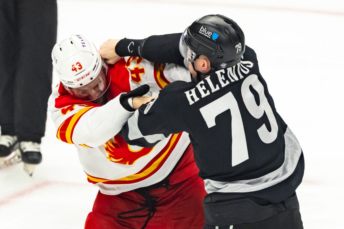 Center Samuel Helenius #79 of the Los Angeles Kings lands a punch on right wing Adam Klapka #43 of the Calgary Flames in an early fight during an NHL hockey game, Saturday December 13, 2025 in Los Angeles, Calif.