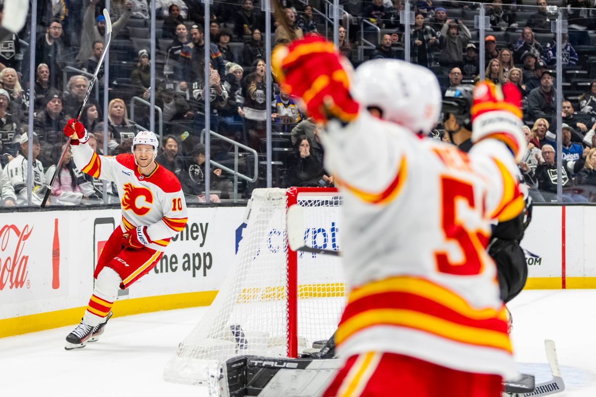 Left wing Jonathan Huberdeau #10 of the Calgary Flames celebrates the victory in overtime during an NHL hockey game against the Los Angeles Kings, Saturday December 13, 2025 in Los Angeles, Calif.