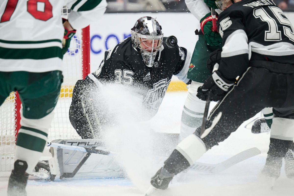 The Los Angeles Kings goaltender Darcy Kuemper (35) and  center Alex Turcotte (15) defend the goal against the Minnesota Wild at the Crypto Arena on January 5th, 2026 in Los Angeles California.