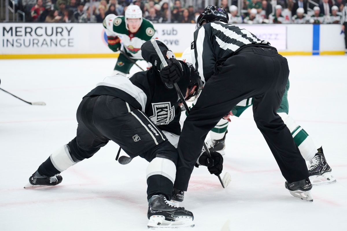 The Los Angeles Kings center Alex Turcotte (15) does a face off against the Minnesota Wild at the Crypto Arena on January 5th, 2026 in Los Angeles California.