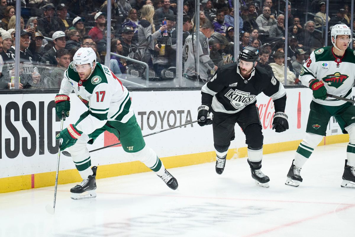 The Los Angeles Kings defender Joel Edmundson (6) races for the puck against the Minnesota Wild at the Crypto Arena on January 5th, 2026 in Los Angeles California.