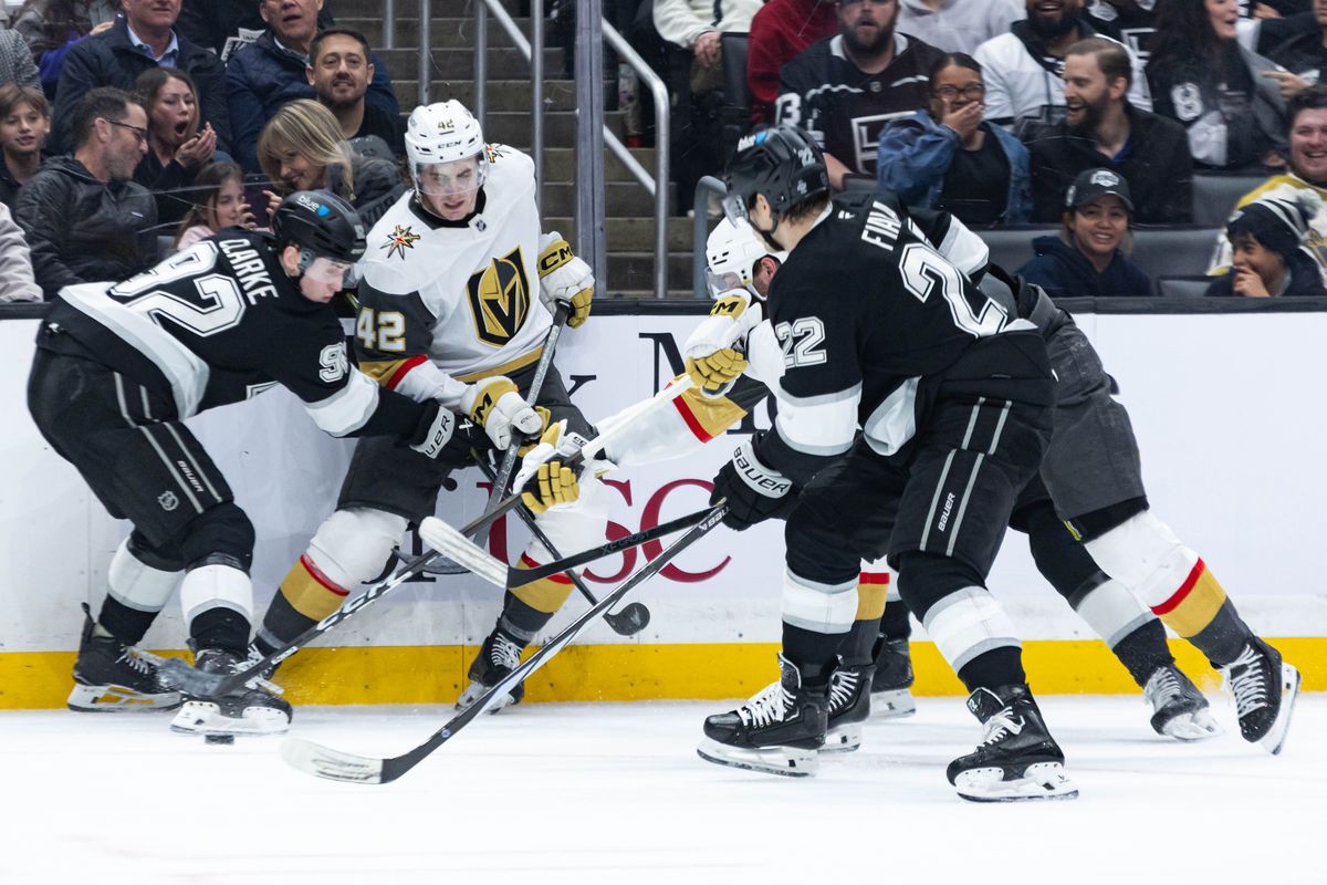Los Angeles Kings defenseman Brandt Clarke (92) and left wing Kevin Fiala (22) attempts to gain control of the puck during an NHL match against the Vegas Golden Knights on January 14, 2025 in Los Angeles, Calif.