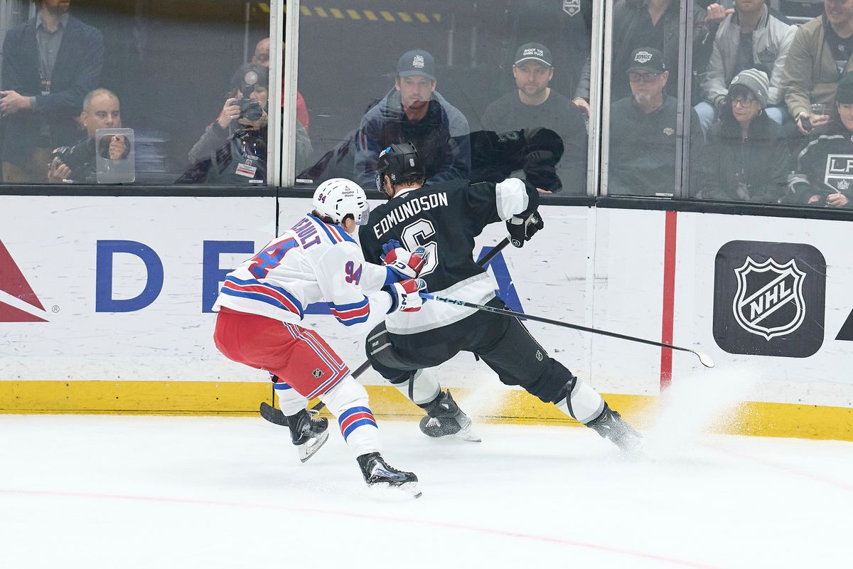 The Los Angeles Kings defender Joel Edmundson (6) gains possession against the New York Rangers at the Crypto Arena on January 20th, 2026 in Los Angeles California.