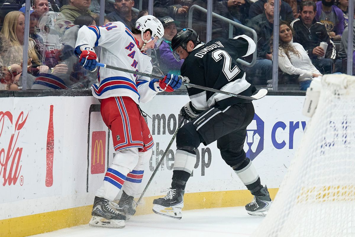 The Los Angeles Kings defender Brian Dumoulin (2) fights for the puck against the New York Rangers at the Crypto Arena on January 20th, 2026 in Los Angeles California.