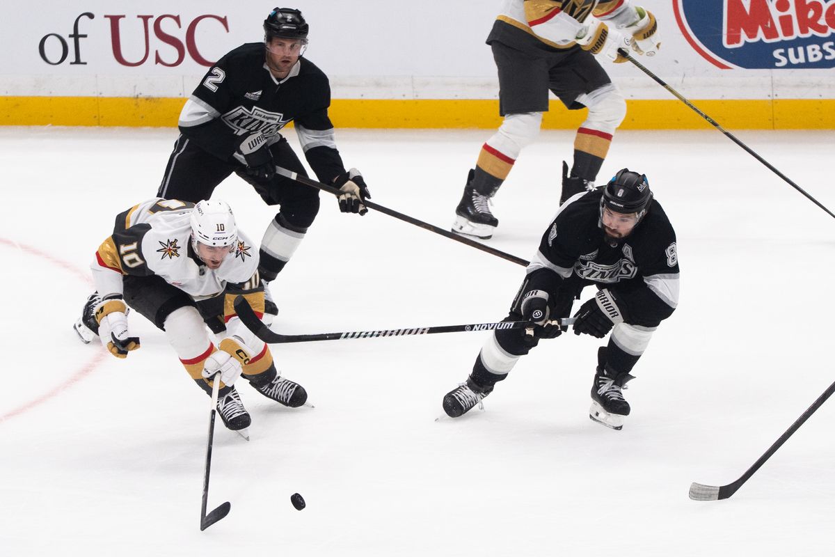 Los Angeles Kings Defender Drew Doughty (8) attempts to steal the puck against his opponent during an NHL match against the Vegas Golden Knights on February 25, 2025 in Los Angeles, Calif.
