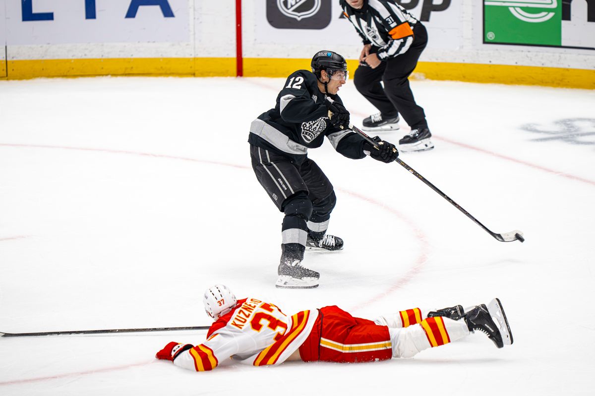 Los Angeles Kings left wing Trevor Moore (12) unsuccessfully taking a shot at goal during an NHL hockey game against the Calgary Flames on February 26th, 2026 in Los Angeles, CA.